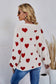 All over heart sweater